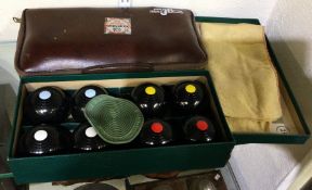 A good cased set of carpet bowls. Est. £20 - £30.