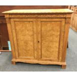 An attractive burr walnut two door cupboard with c