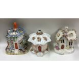 A group of three Staffordshire houses. Est. £20 -