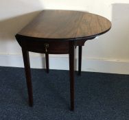 A mahogany two flap Pembroke table. Est. £30 - £50