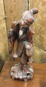 An old root wood carved Oriental figure. Est. £15