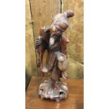 An old root wood carved Oriental figure. Est. £15