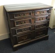 A large Georgian oak chest of four drawers on brac