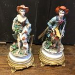 An attractive pair of 20th Century figures on gild