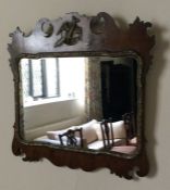An attractive mahogany mirror with bird decoration