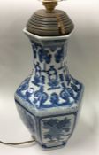 A tall blue and white Chinese vase of typical form