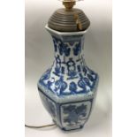 A tall blue and white Chinese vase of typical form