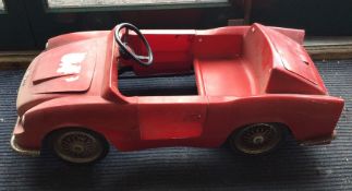 A small child's model of an Aston Martin. Est £40