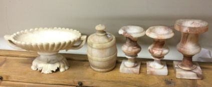 A set of three alabaster urns together with a cent