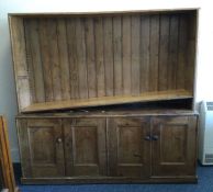 A large pine four drawer kitchen dresser with pane