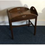 A mahogany butler's tray on stand. Est. £20 - £30.