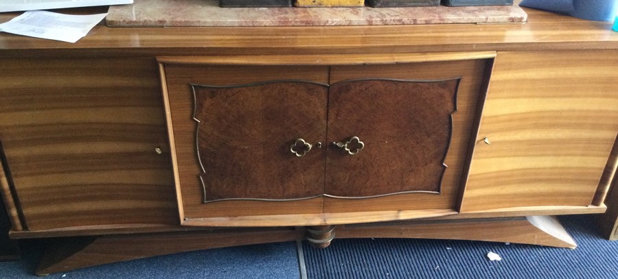 A massive retro four door sideboard on sweeping ba