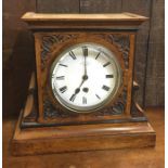 A Victorian mahogany mantle clock. Est. £30 - £50.