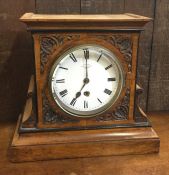 A Victorian mahogany mantle clock. Est. £30 - £50.