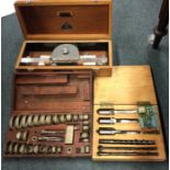A cased set of chisels together with a clinometer