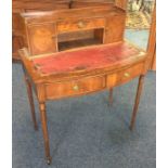 A 20th Century mahogany bow front two drawer desk.