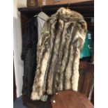 Two old fur coats together with a stole. Est. £20