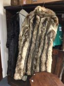 Two old fur coats together with a stole. Est. £20