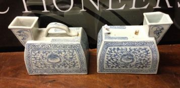 A pair of Chinese blue and white vases decorated w