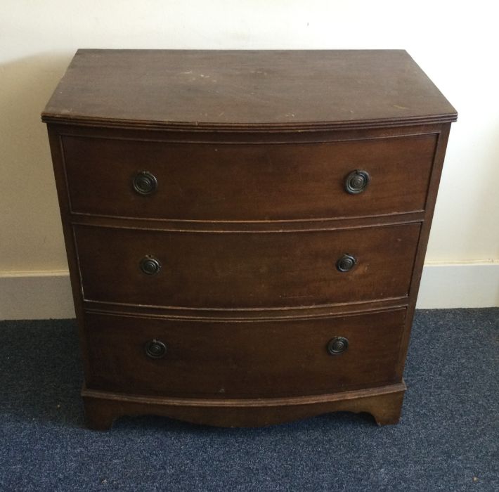 An Edwardian mahogany bow front chest of three dra