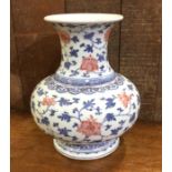 A Chinese blue and white baluster shaped vase with