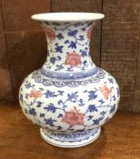 A Chinese blue and white baluster shaped vase with