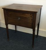 A Georgian mahogany hinged front side table on fou