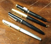 A Parker fountain pen together with three others.