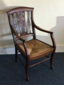 A Continental mahogany chair with cane seat. Est.