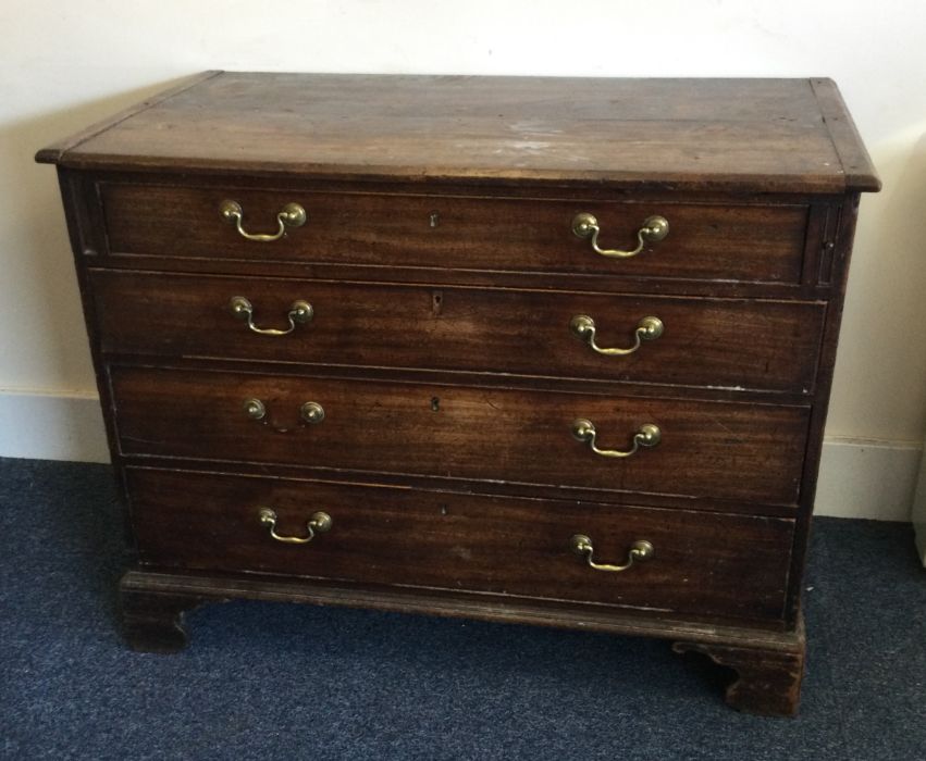 A large Georgian mahogany chest of four drawers on