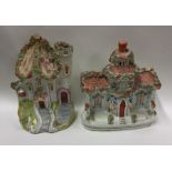 A pair of unusual Staffordshire figures of houses.