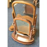 Two Victorian mahogany dressing table mirrors. Est