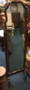 A shaped mahogany dressing mirror. Est. £30 - £50.