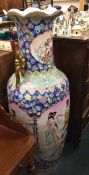 A massive Chinese vase decorated in bright colours