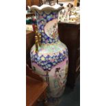 A massive Chinese vase decorated in bright colours