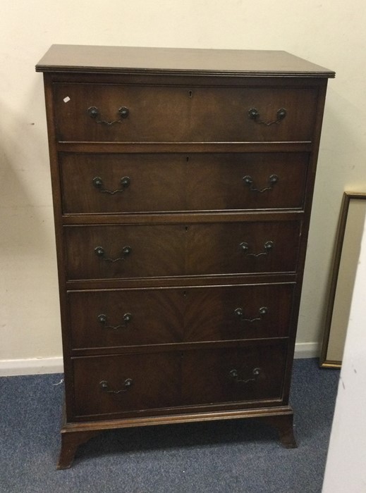A reproduction mahogany chest of five drawers. Est