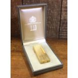 DUNHILL: A cased gold plated lighter. Est. £20 - £