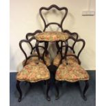 A set of six Victorian hoop back chairs on cabriol