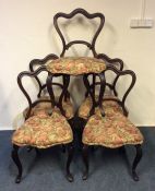 A set of six Victorian hoop back chairs on cabriol