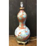 A tall Chinese baluster shaped vase decorated in b