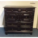 An early Georgian oak chest of four long drawers o