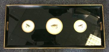 An unusual lacquer tray decorated with fishing fli