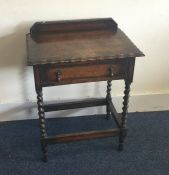 An oak barley twist single drawer table. Est. £20