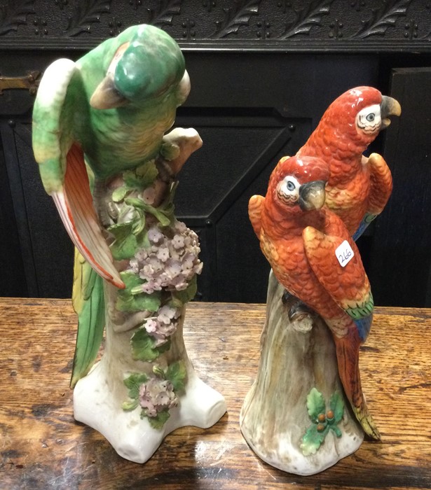 An Antique pottery figure of a Macaw together with