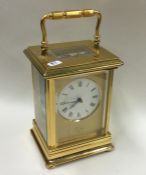 A large heavy brass mounted carriage clock. By Jam