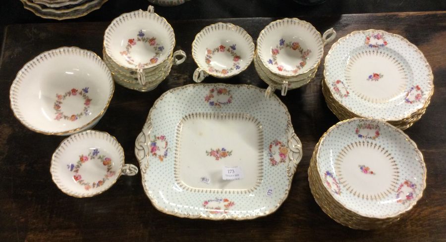 MINTONS: A decorated tea service with gilt border.