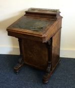 A good Victorian walnut Davenport with inlaid deco