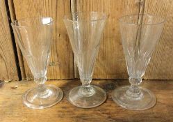 A good set of three Georgian glasses of fluted des