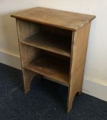 An open pine bookshelf with plank top. Est. £30 -