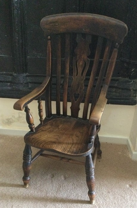 A large 18th Century Windsor chair with stretcher